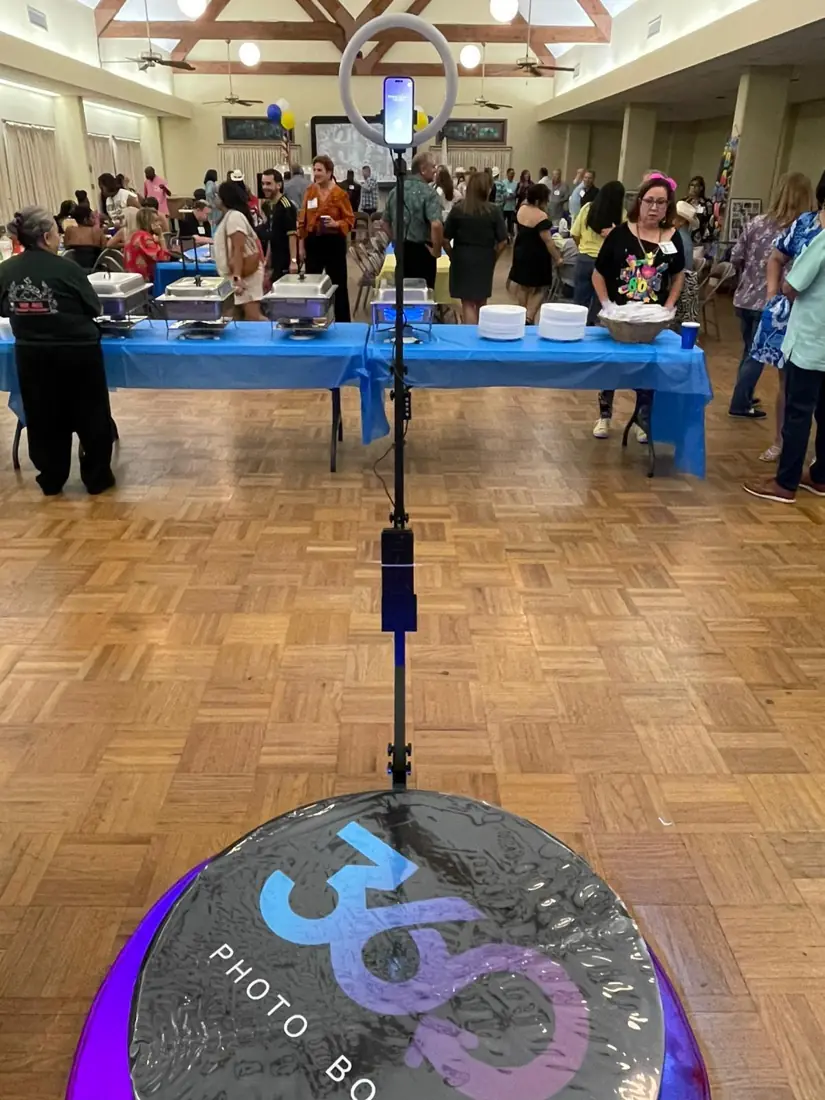 360 booth ring light set up at a busy party hall